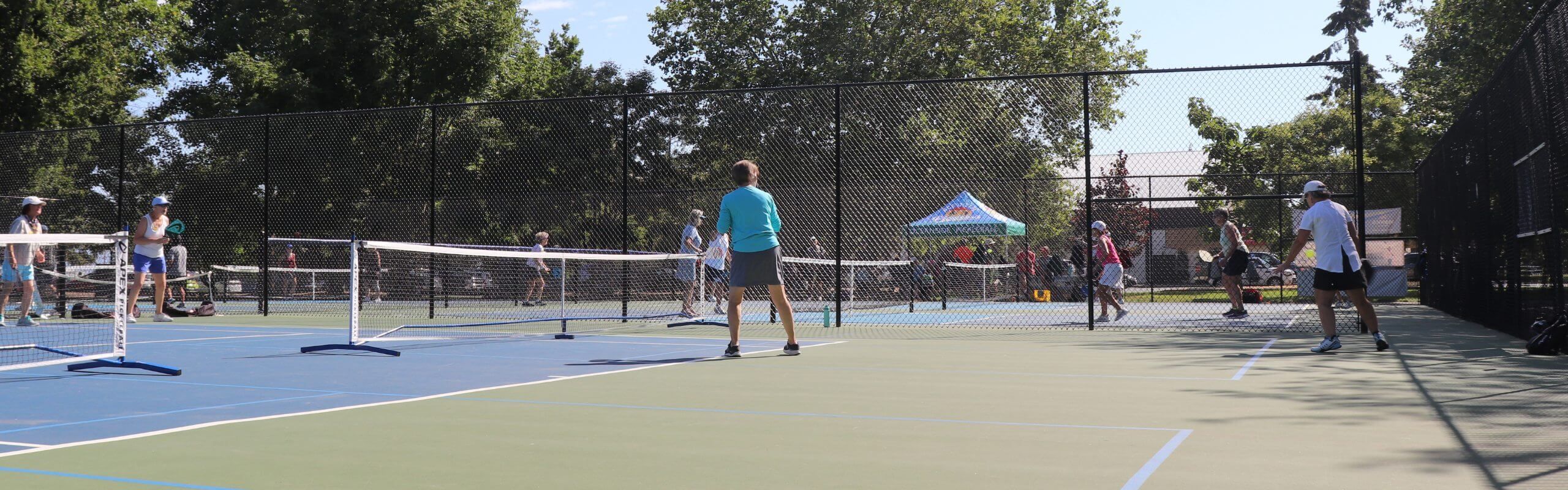 Oceanside Pickleball players playing on the courts Oceanside Pickleball Volunteering